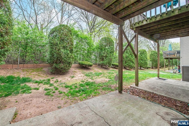 view of yard with a patio and fence