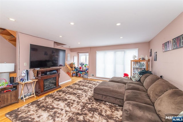 living area featuring recessed lighting and wood finished floors