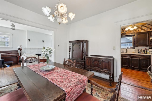 dining space featuring an inviting chandelier and wood-type flooring