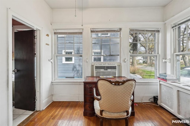 sunroom / solarium featuring radiator and cooling unit