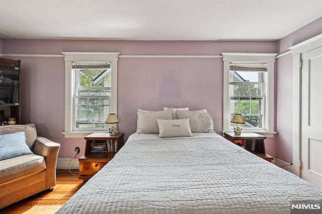 bedroom featuring wood finished floors