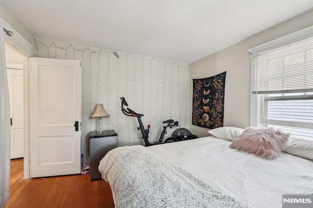 bedroom featuring wood finished floors