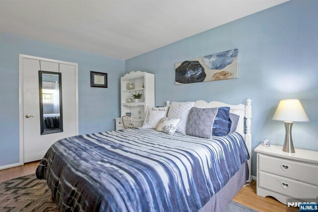 bedroom featuring wood finished floors