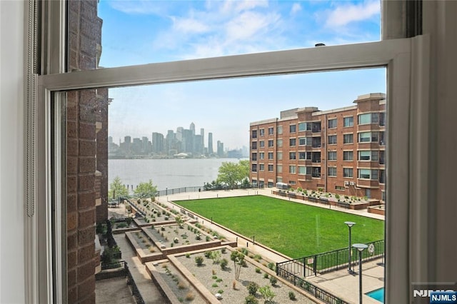 balcony featuring a water view and a view of skyline