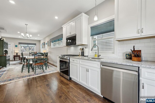 5 Banks Dr, Boonton Town, NJ 07005 - kitchen with recessed lighting, appliances with stainless steel finishes, decorative backsplash, and a sink