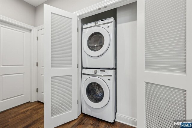5 Banks Dr, Boonton Town, NJ 07005 - laundry room featuring stacked washer and clothes dryer, dark wood-style floors, and laundry area