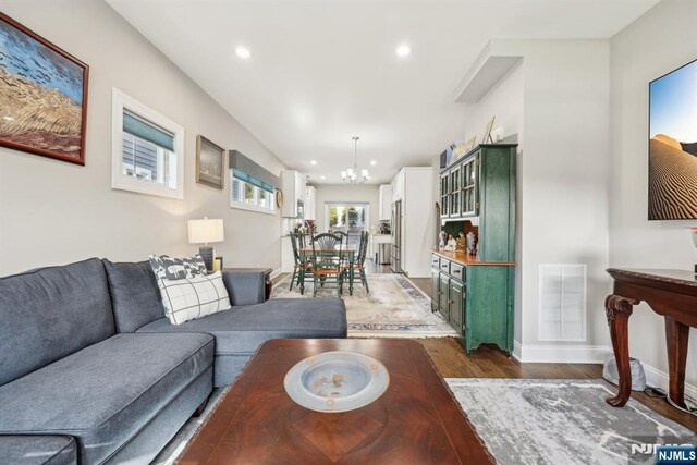 5 Banks Dr, Boonton Town, NJ 07005 - living room with recessed lighting, wood finished floors, visible vents, and an inviting chandelier
