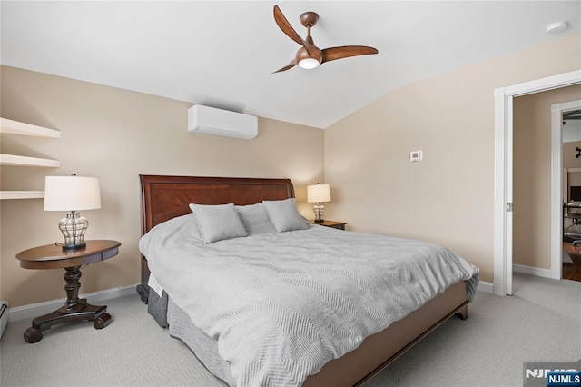 bedroom with baseboards, vaulted ceiling, carpet floors, and a wall unit AC