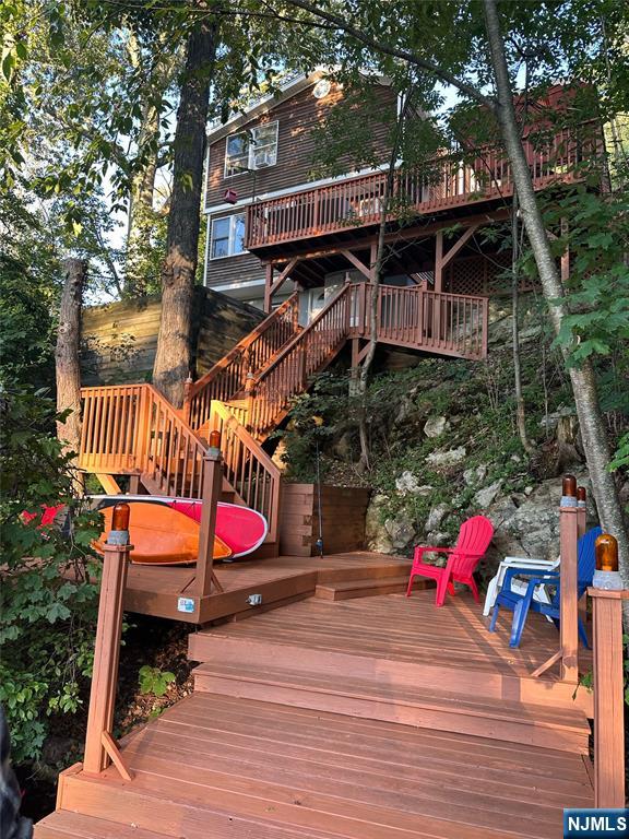 wooden deck featuring stairs