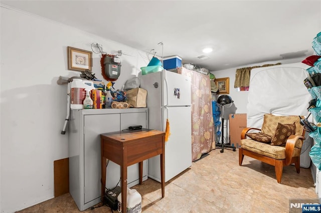 kitchen with freestanding refrigerator