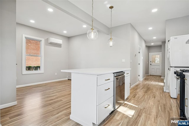 kitchen with light wood-type flooring, light countertops, baseboards, and white cabinets