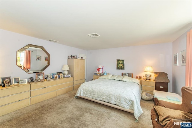 bedroom with carpet flooring and visible vents