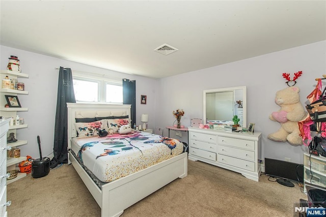 bedroom featuring carpet floors and visible vents