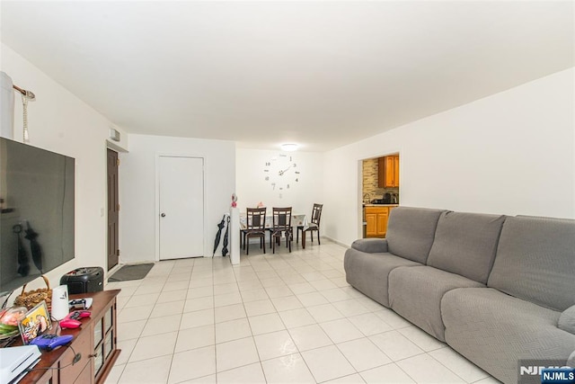 living room with light tile patterned floors