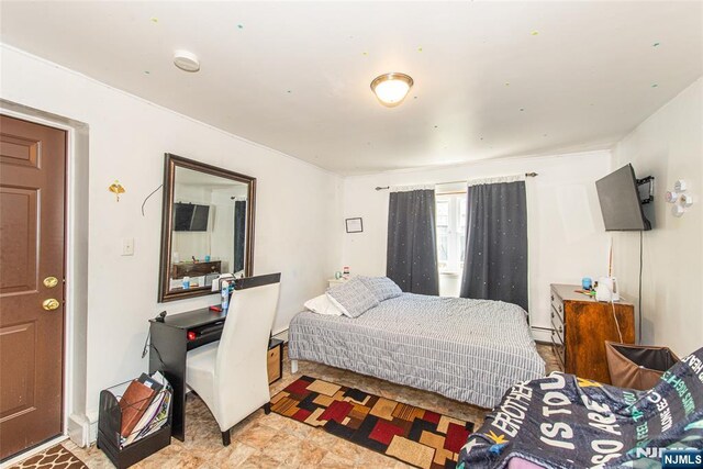 bedroom with baseboard heating