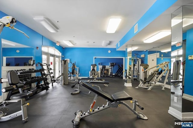 exercise room with french doors and visible vents