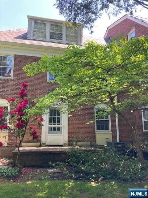 back of house with brick siding