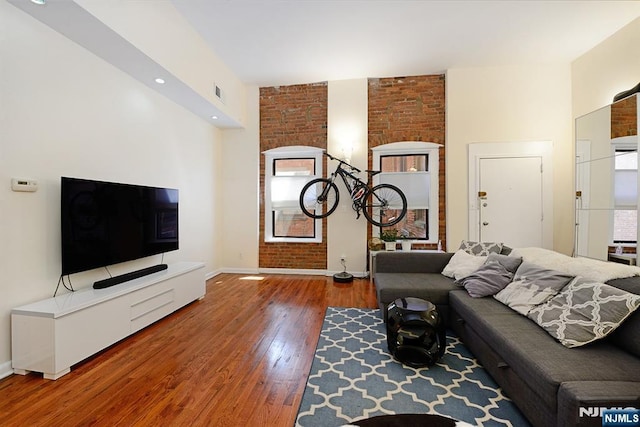 living room featuring wood-type flooring and baseboards