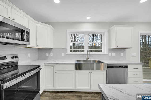 305 Mountainside Dr, Vernon, NJ 07422 - kitchen featuring appliances with stainless steel finishes, a sink, recessed lighting, white cabinetry, and light stone countertops