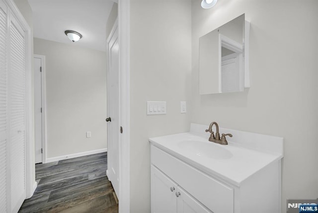 305 Mountainside Dr, Vernon, NJ 07422 - bathroom with wood finished floors, a closet, vanity, and baseboards