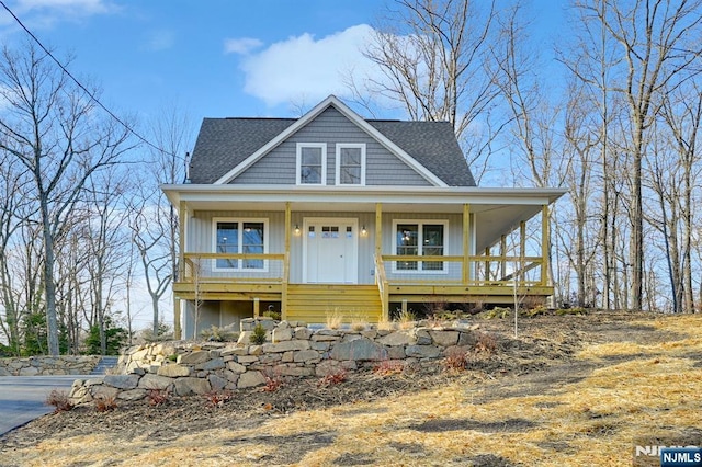 305 Mountainside Dr, Vernon, NJ 07422 - view of front of home with a porch, roof with shingles, and board and batten siding