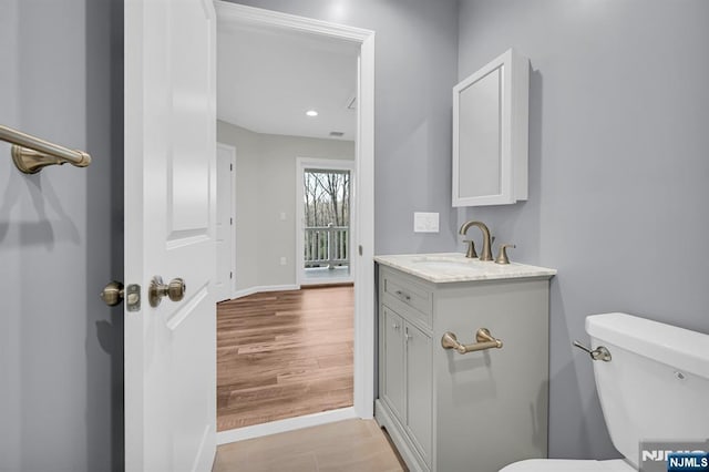 305 Mountainside Dr, Vernon, NJ 07422 - bathroom with toilet, vanity, baseboards, wood finished floors, and recessed lighting