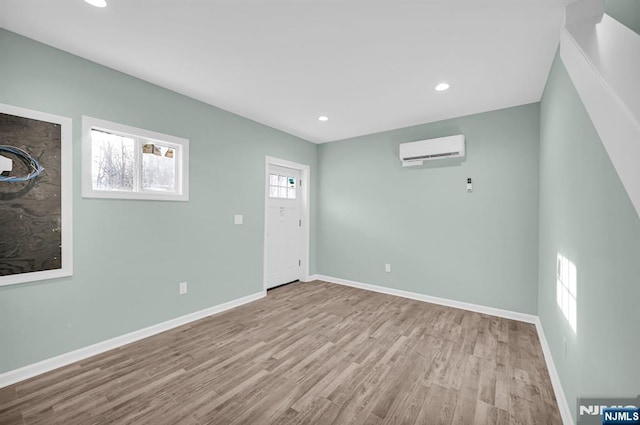 305 Mountainside Dr, Vernon, NJ 07422 - spare room featuring a wall unit AC, wood finished floors, baseboards, and recessed lighting