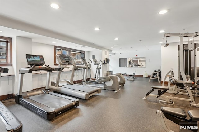 gym featuring baseboards and recessed lighting