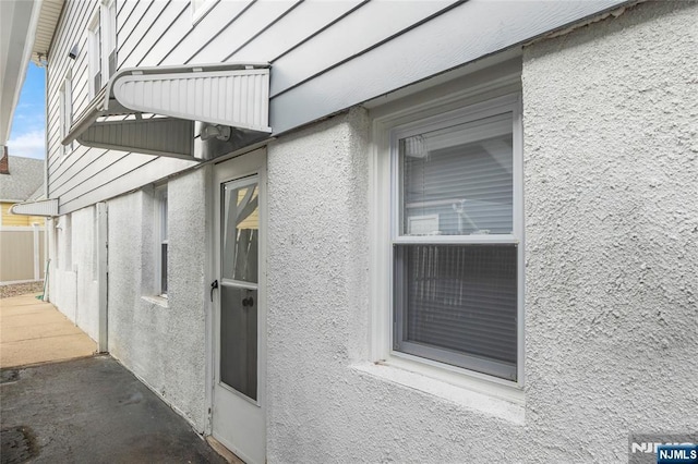 61 Sabina St, Little Ferry, NJ 07643 - view of home's exterior featuring stucco siding