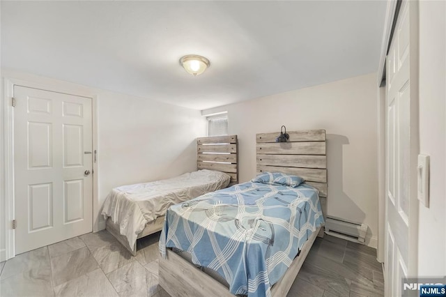 61 Sabina St, Little Ferry, NJ 07643 - bedroom featuring a baseboard heating unit