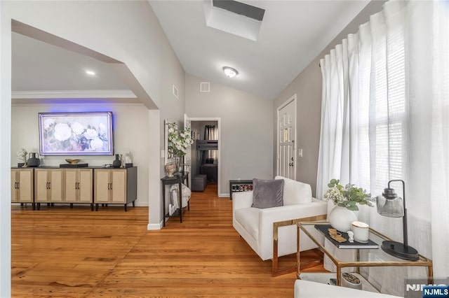 61 Sabina St, Little Ferry, NJ 07643 - living area with light wood-style flooring, visible vents, and lofted ceiling