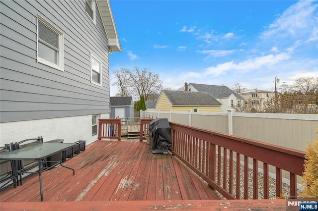 61 Sabina St, Little Ferry, NJ 07643 - deck featuring grilling area, an outdoor structure, fence, and a storage unit