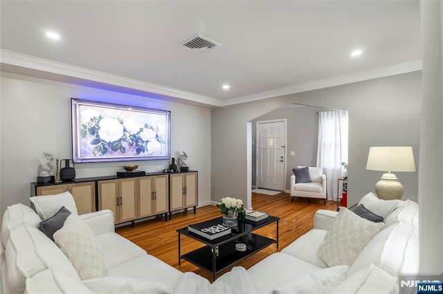 61 Sabina St, Little Ferry, NJ 07643 - living area featuring crown molding, wood finished floors, visible vents, and recessed lighting