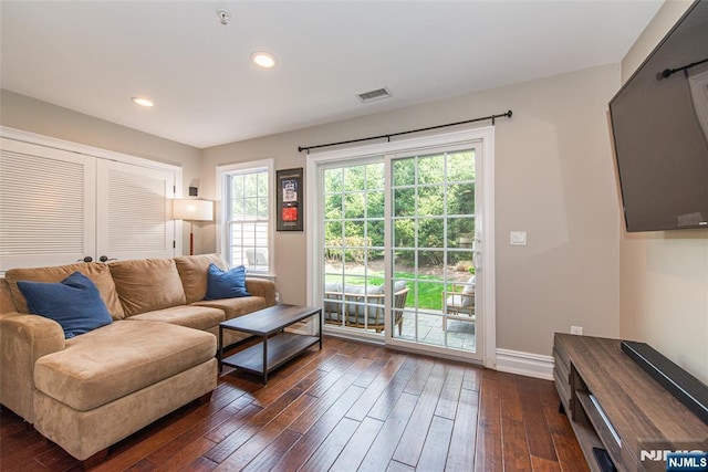 living area with visible vents, recessed lighting, baseboards, and dark wood-style floors