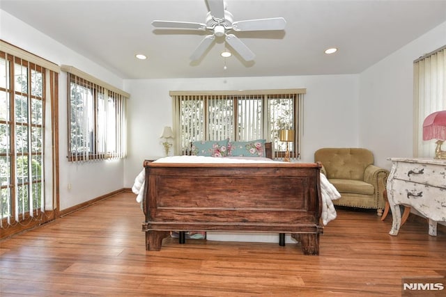 bedroom featuring recessed lighting, baseboards, ceiling fan, and light wood-style floors