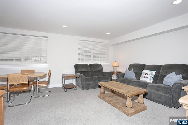 living room with baseboards, carpet, and recessed lighting