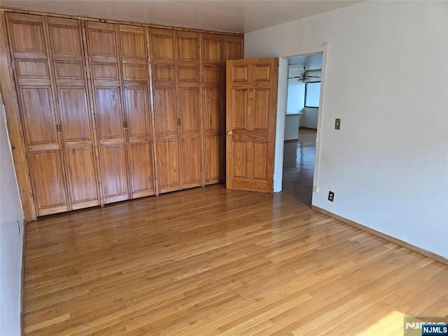 270 Marin Blvd Unit 12-O, Jersey City, NJ 07302 - unfurnished bedroom with light wood finished floors and baseboards