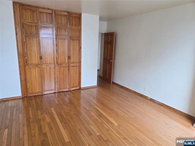 270 Marin Blvd Unit 12-O, Jersey City, NJ 07302 - unfurnished bedroom featuring hardwood / wood-style floors