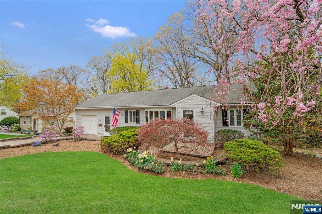 196 Spruce St, Midland Park, NJ 07432 - ranch-style home featuring a front yard, driveway, and a garage