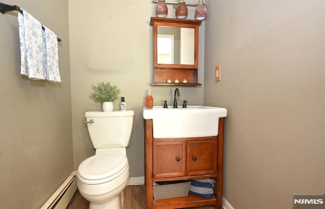 28 White Birch Ter, Kinnelon Borough, NJ 07405 - bathroom with toilet, baseboards, a baseboard heating unit, and vanity