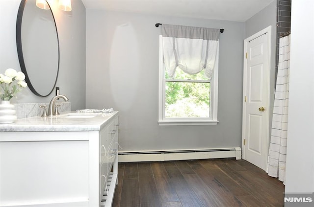 28 White Birch Ter, Kinnelon Borough, NJ 07405 - bathroom with vanity, a baseboard radiator, and hardwood / wood-style flooring