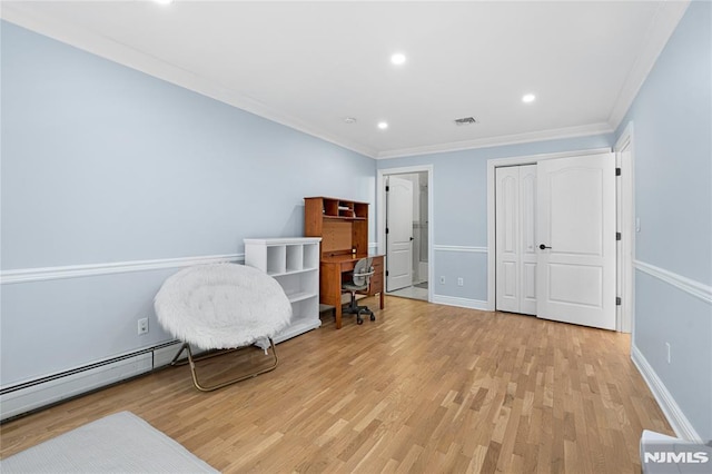sitting room with recessed lighting, visible vents, baseboard heating, and light wood-type flooring