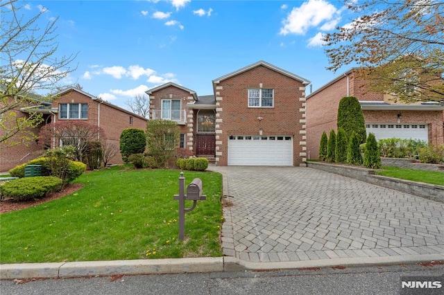 traditional-style house featuring decorative driveway, a garage, a front lawn, and brick siding