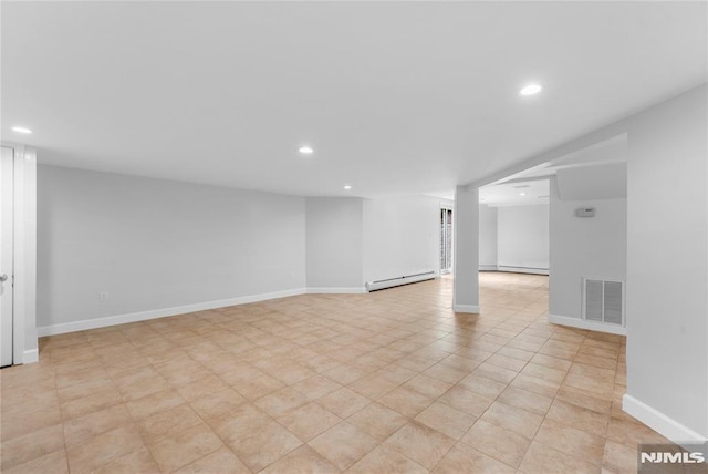 finished basement with recessed lighting, baseboards, visible vents, and a baseboard radiator