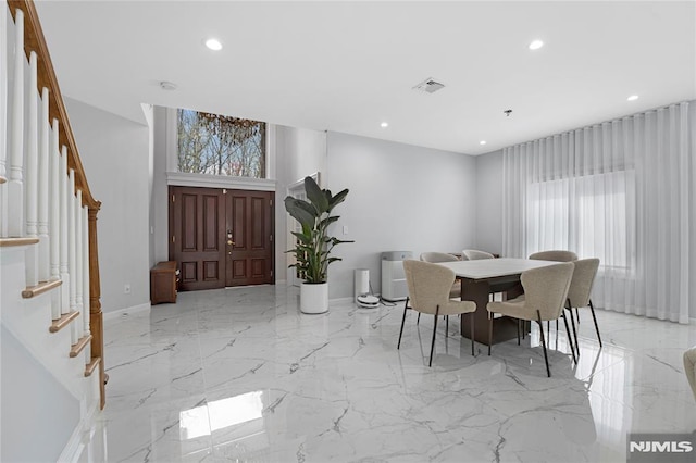 dining room featuring visible vents, marble finish floor, stairs, baseboards, and recessed lighting