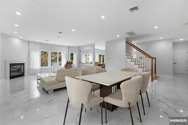dining room featuring visible vents, recessed lighting, and marble finish floor