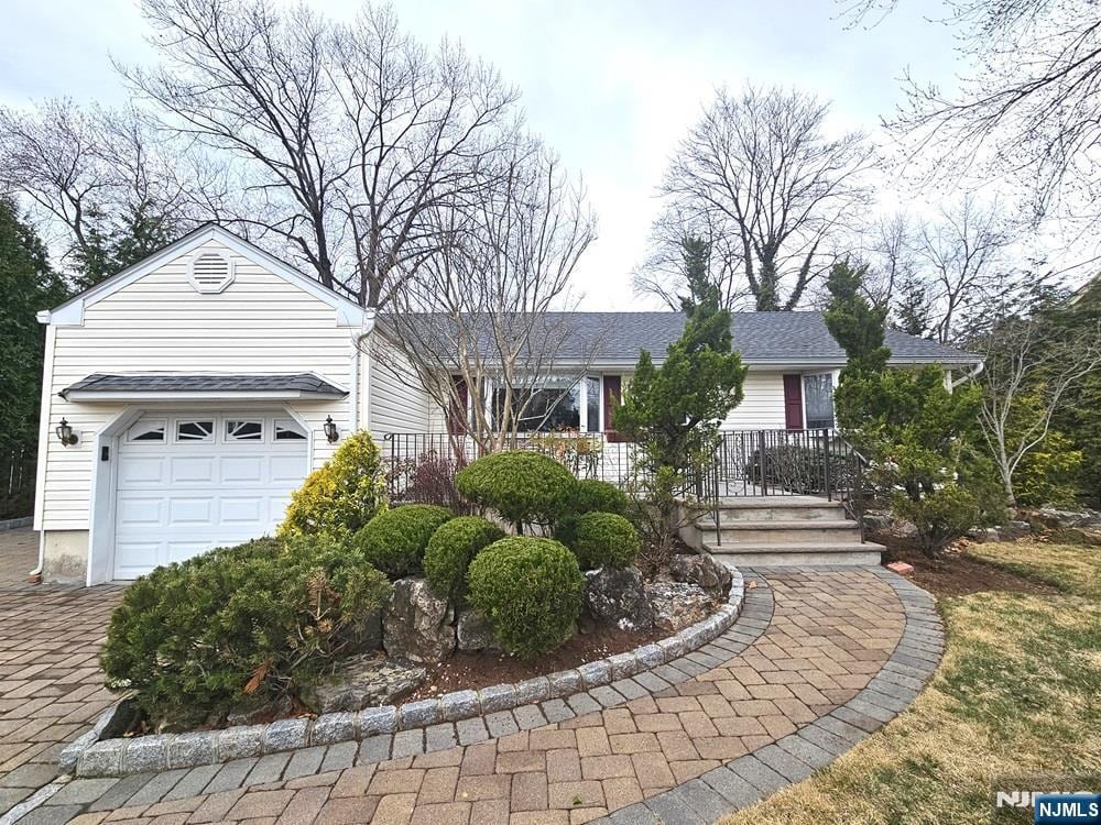 ranch-style home featuring a garage