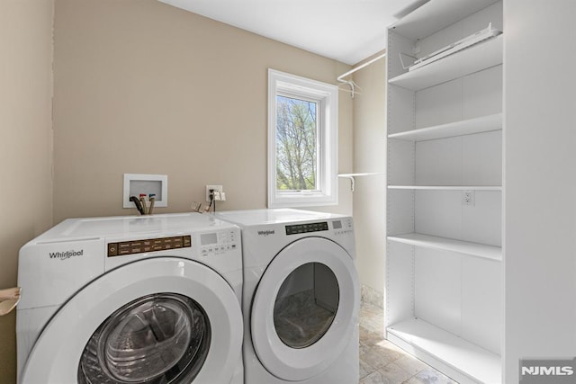 laundry area with laundry area and washer and clothes dryer