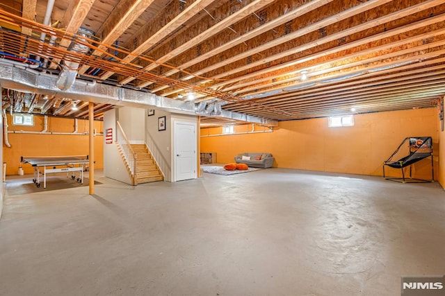 basement featuring stairs