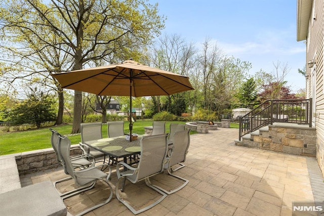 view of patio / terrace featuring a fire pit and outdoor dining space